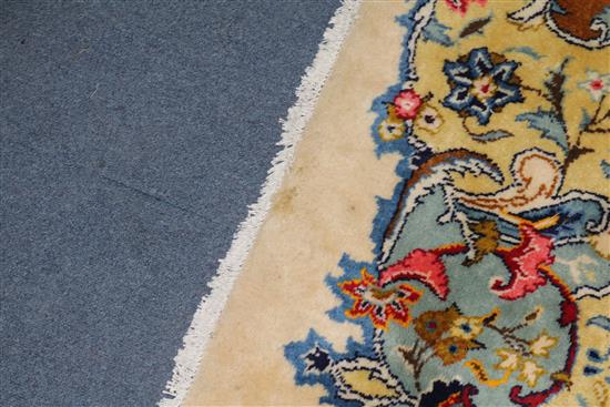 A Persian ivory ground carpet 390 x 290cm